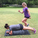 Two women working out in a park together