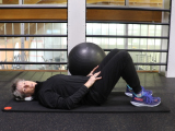 Trainer performing core exercise