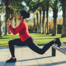 Woman using a bench to work out.