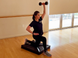 Trainer demonstrating a weight-bearing exercise