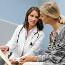 female doctor talking with patient