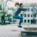 woman doing air jump squat