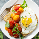 Breakfast of egg, toast and tomatoes