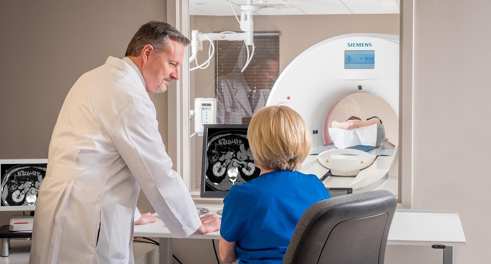 Medium-shot of male doctor explaining MRI scan