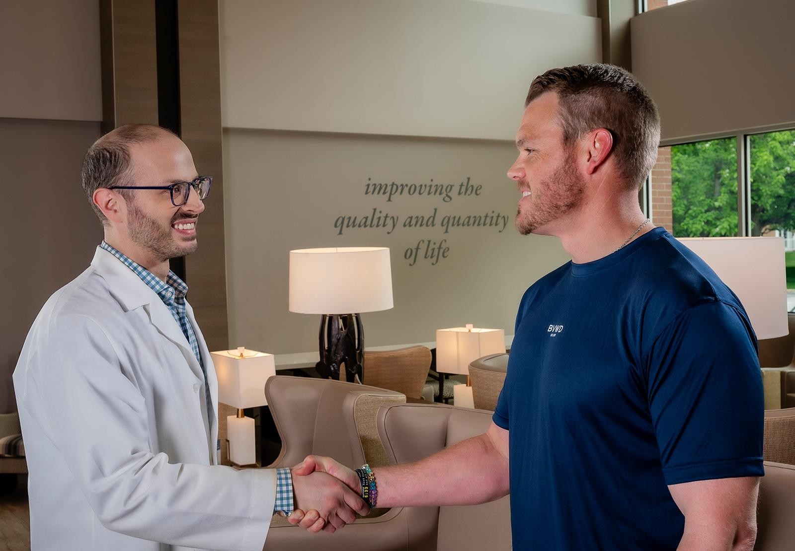 Cooper doctor shaking hands with client