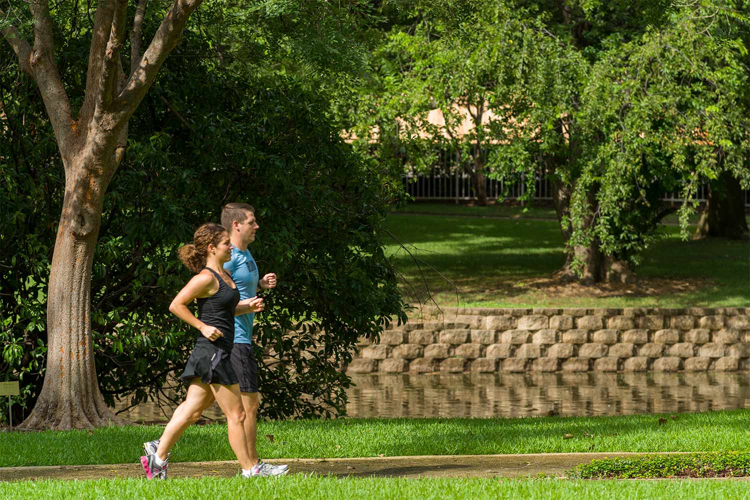 Two people walking on track