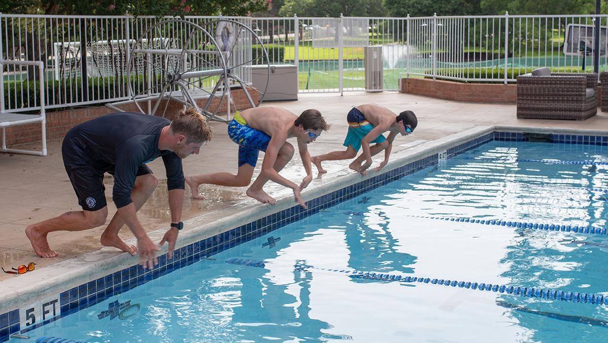 Group of people about to jump into a pool at Cooper's facility