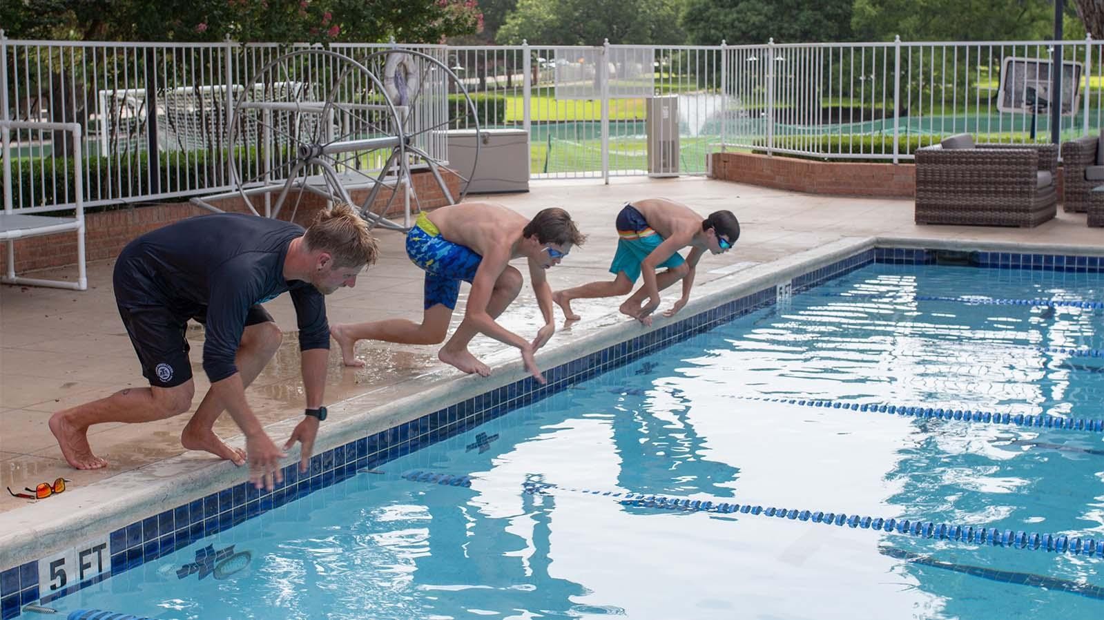 Swimming - Youth swimmer swimming laps in pool