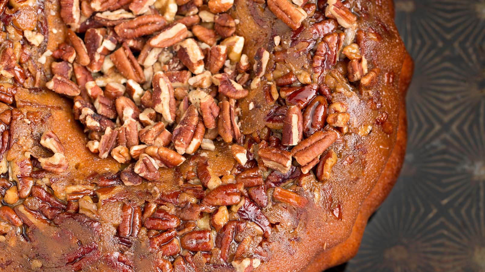 Praline Cake with Whipped Topping and Pecans
