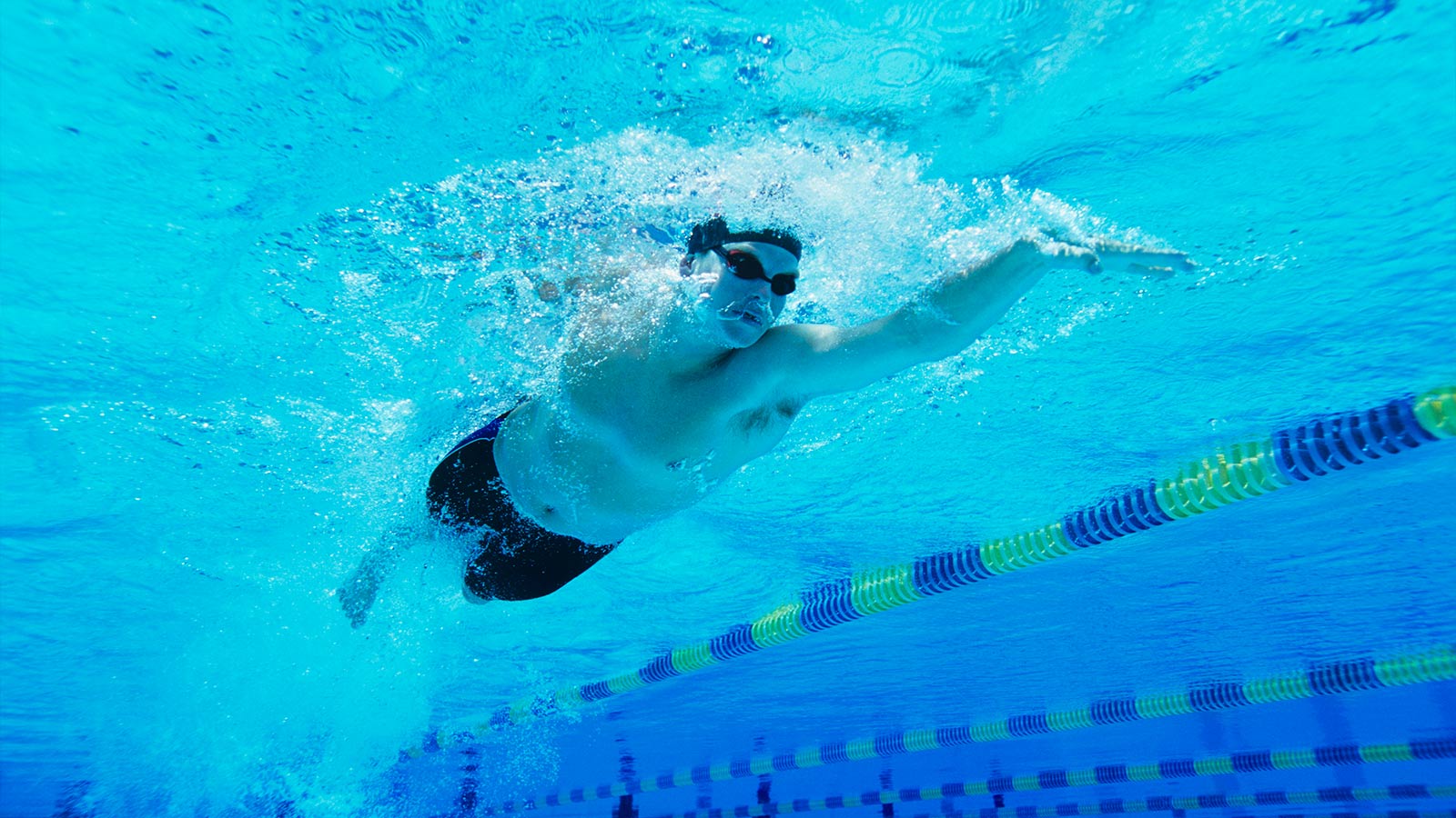 Man Swimming in Pool