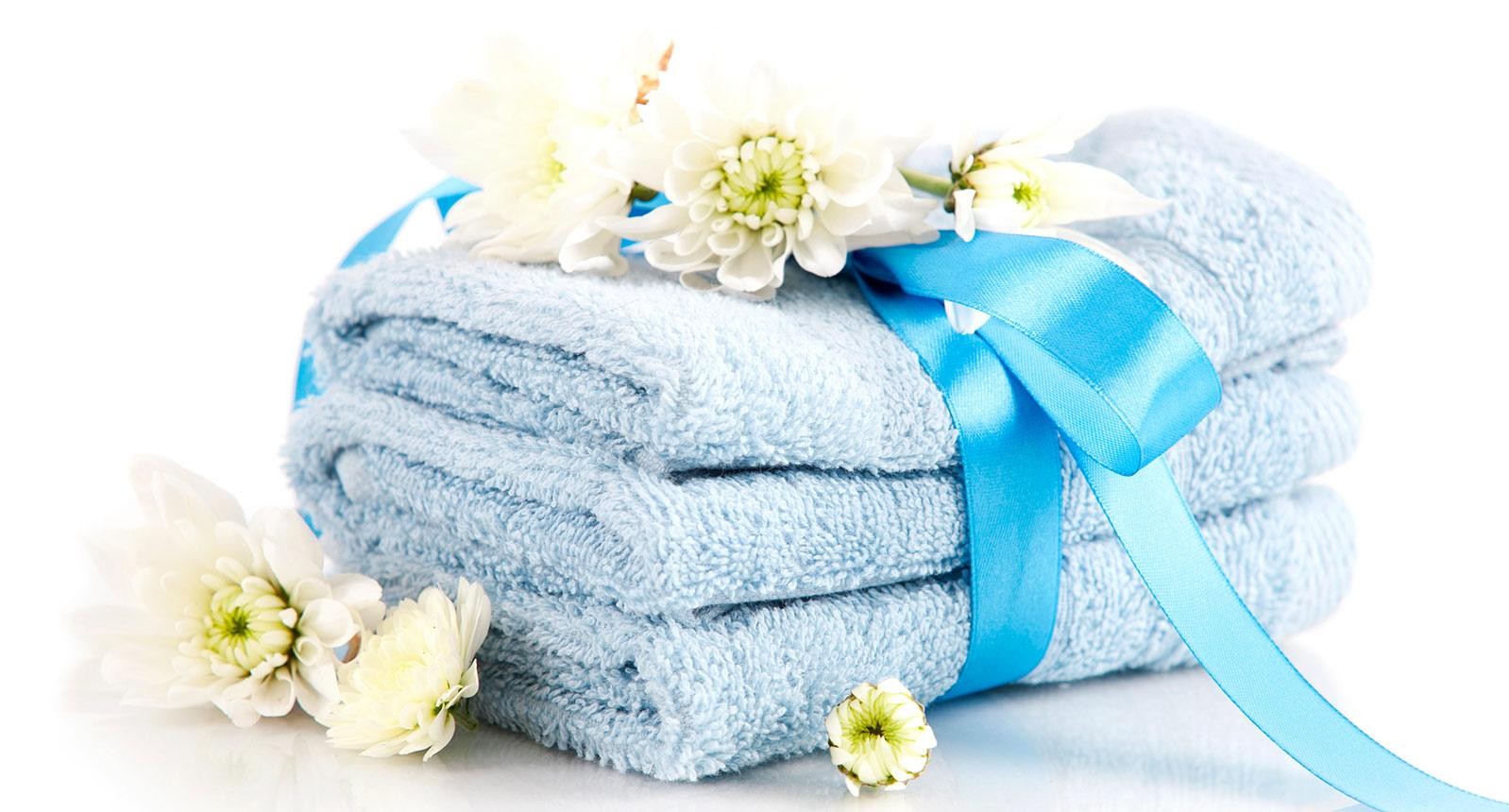 Blue towels and ribbon with flowers