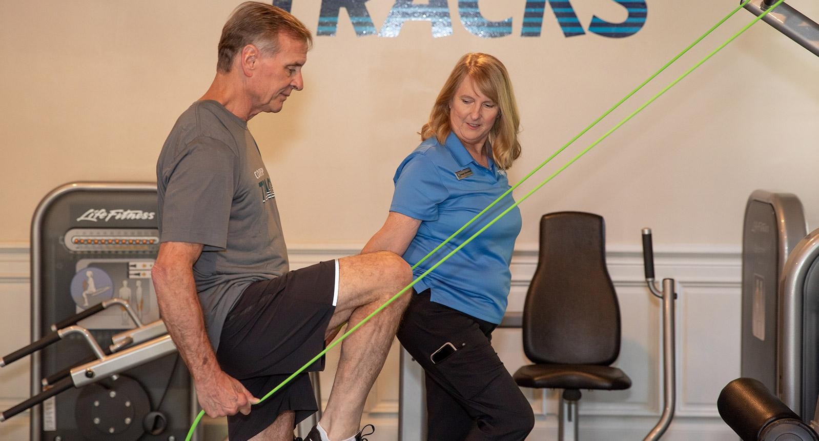 Cooper trainer training a man for the Cooper Tracks wellness strategy
