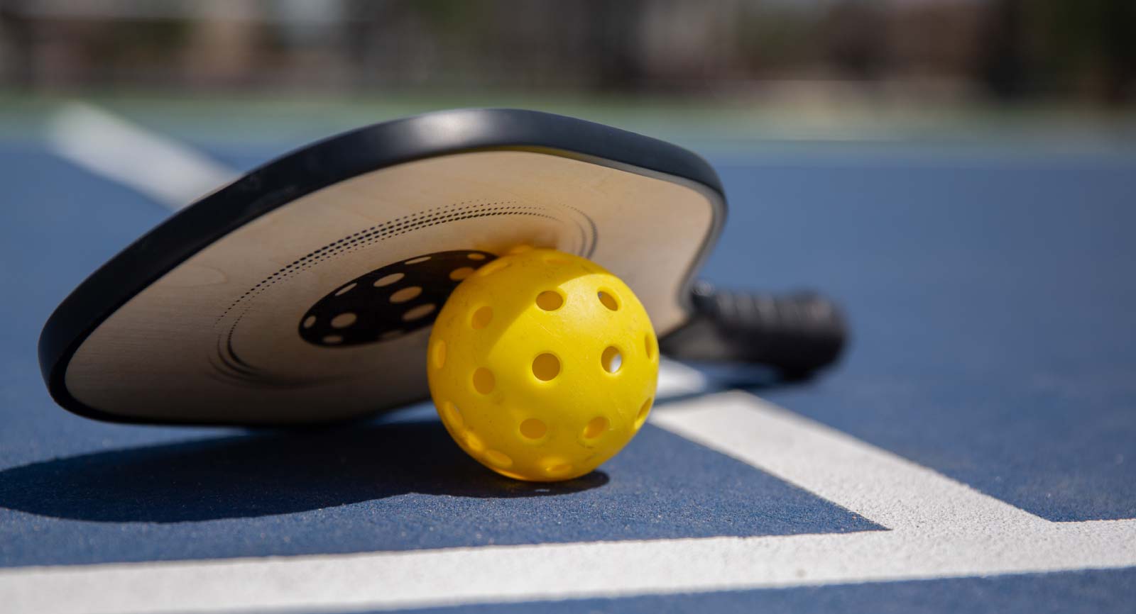 Pickleball racquet and ball