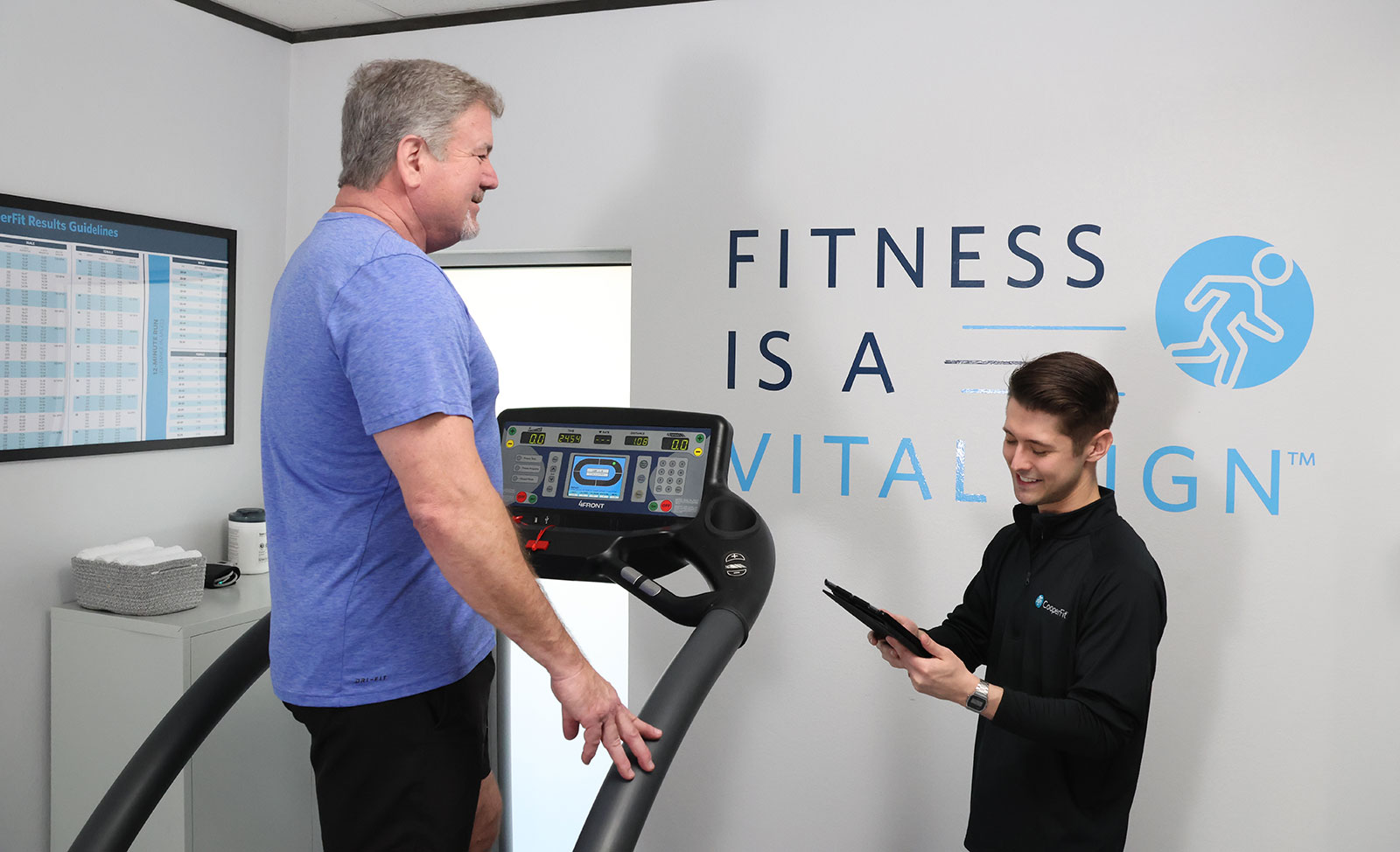 Person on treadmill with trainer