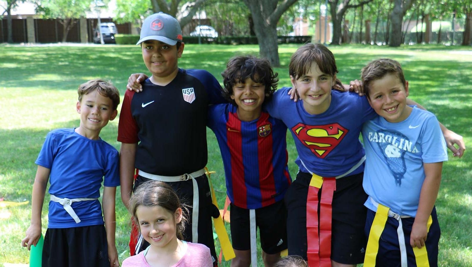2c7ec57c83284e7db329a8007d5281a7_c5x0-1589x898_x1589 group of kids wearing flags