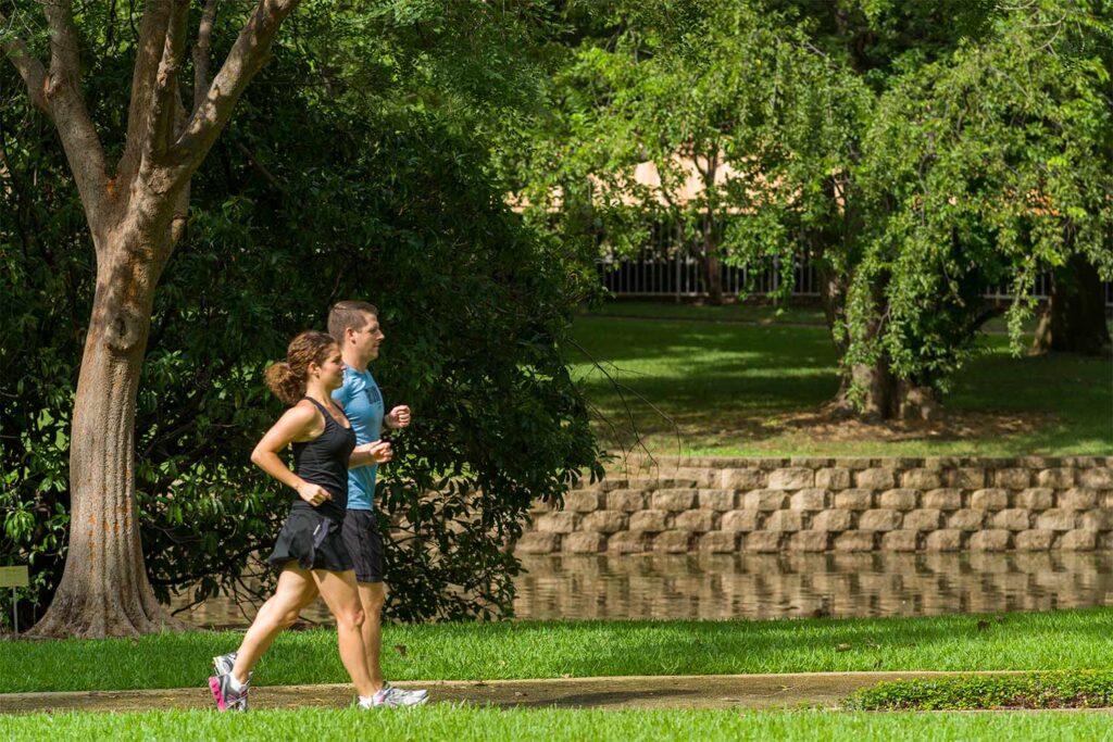Two people walking on track