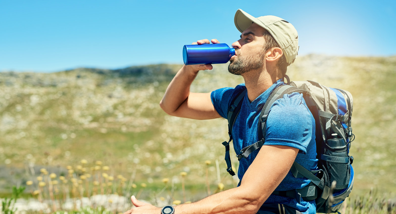 Man Hiking Drinking Water